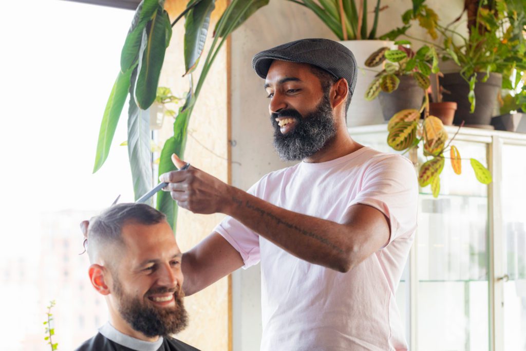 image of barber cutting hair - how to get more reviews